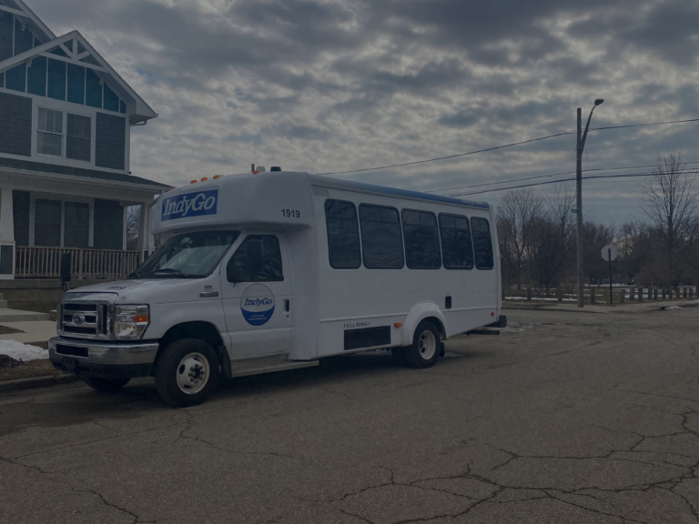 Indgyo van in front of house